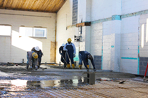 Workers filling in pool
