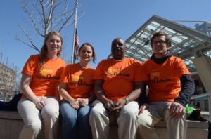 People_seated_in_orange_shirts_Muganda577