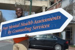Student with sign service day
