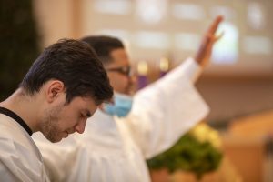 Rodrigo Lima praying in preparation for baptism.